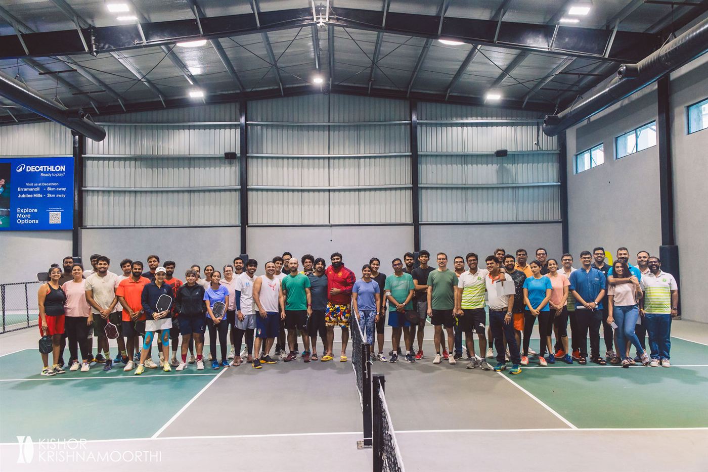 All the pickleball tournament players lined up on court